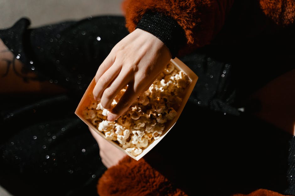 A bucket of popcorn in a movie theater